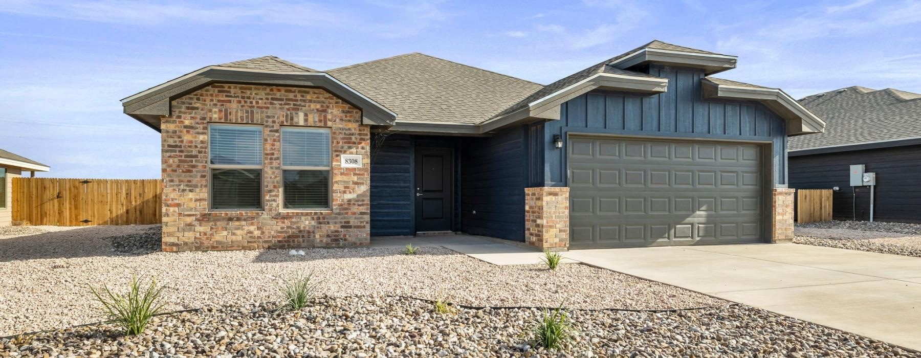 a house with a gravel yard